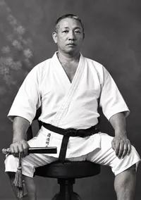 Formal portrait of Professor Henry Seishiro Okazaki in a suit