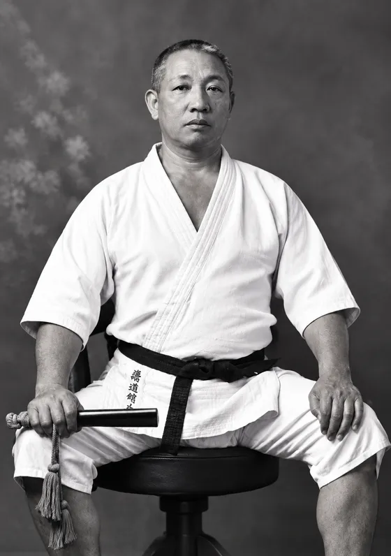 Formal portrait of Professor Henry Seishiro Okazaki wearing a suit, founder of Danzan-ryu Kodenkan Jujitsu