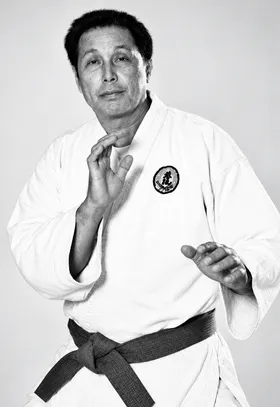 Black-and-white portrait of Professor Wally Jay in a judogi, founder of Small Circle Jujitsu